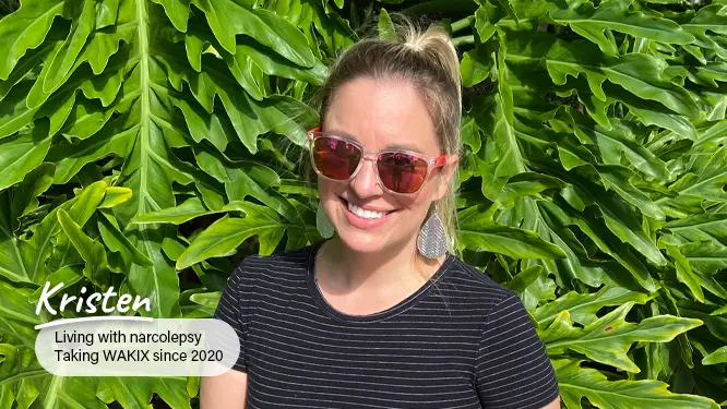Kristen, a real person with narcolepsy taking WAKIX, in a kitchen preparing food